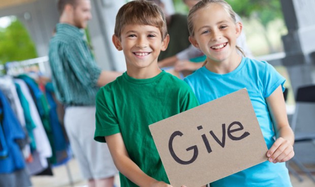 KIDS-HOLDING-GIVE-SIGN