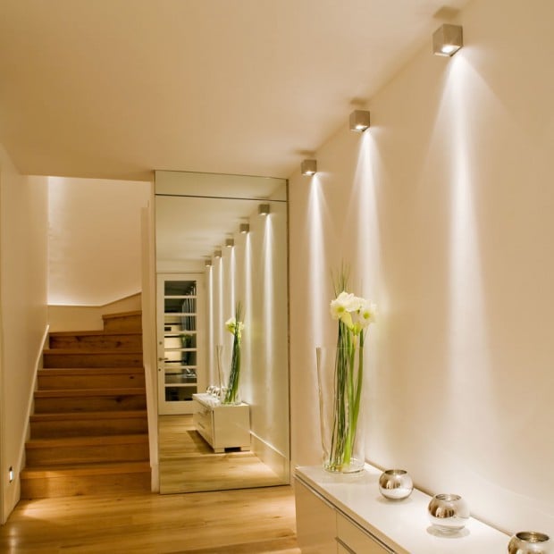 astonishing-home-hallway-interior-design-with-illuminating-bright-wall-lamps-feats-spotlight-shade-above-upholstered-white-wooden-buffet-wall-unit