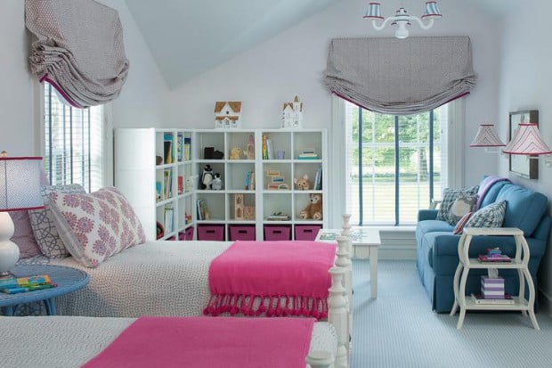 pink-and-blue-girl-room-fringe-throw-blue-skirted-sofa-gray-roman-shade