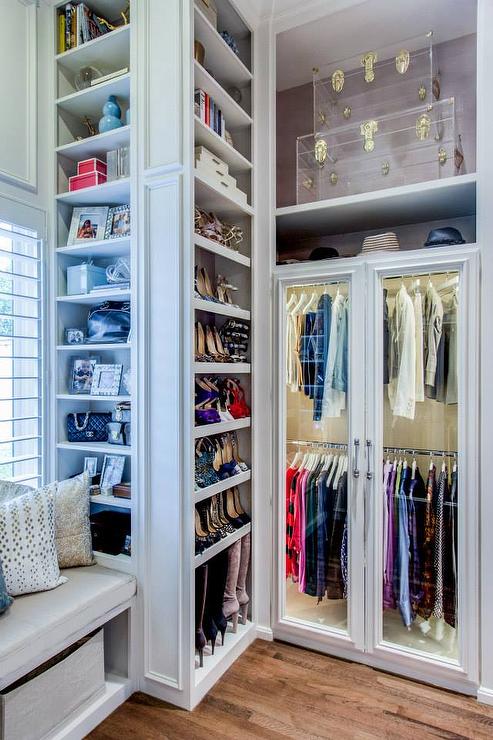 closet-built-in-shoe-shelves-clear-acrylic-trunks-brass-leather-hardware