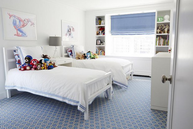 white-and-blue-shared-boys-bedroom-blue-hexagon-rug-window-between-bookcases