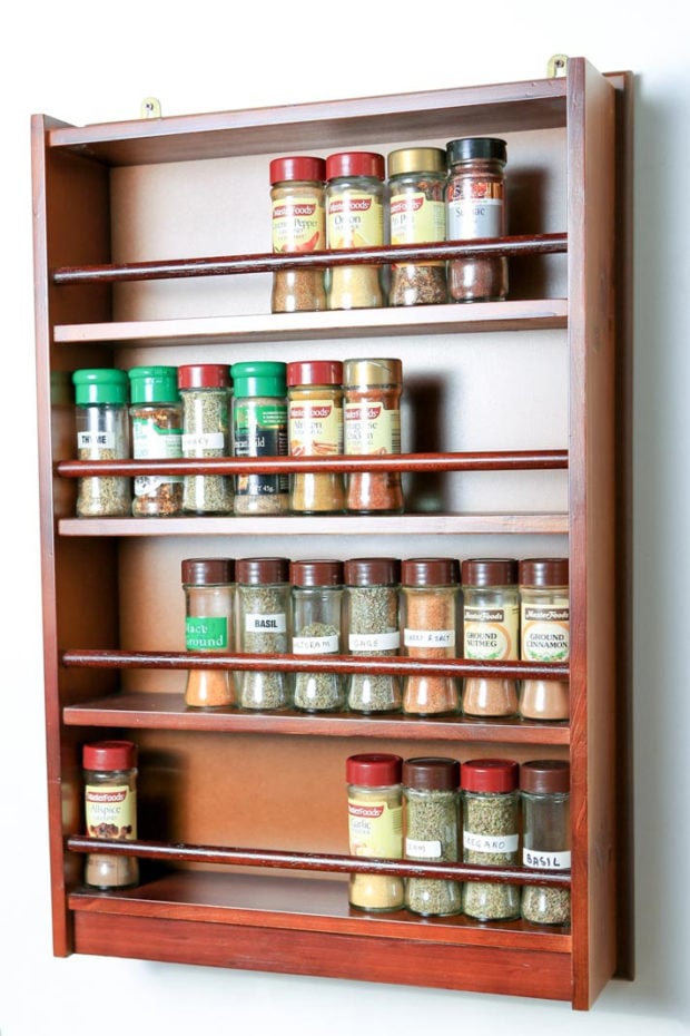 This spice rack can store spice and herb bottles across four shelves and can be wall mounted or placed freestanding in the kitchen or pantry.