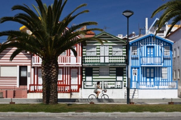 Candy striped painted beach houses, former fishermans houses in Costa Nova, Beira Litoral, Portugal