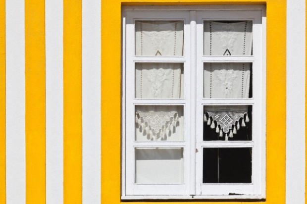 Candy striped painted beach houses, former fishermans houses in Costa Nova, Beira Litoral, Portugal