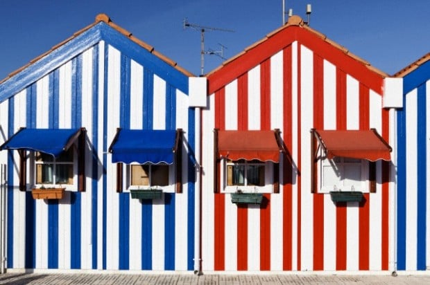 Candy striped painted beach houses, former fishermans houses in Costa Nova, Beira Litoral, Portugal