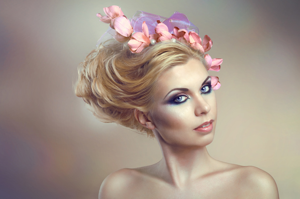 Beautiful Woman with Luxurious Make-Up and Posh Jewelry -