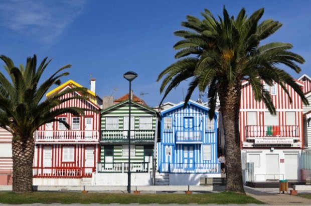 Candy striped painted beach houses, former fishermans houses in Costa Nova, Beira Litoral, Portugal