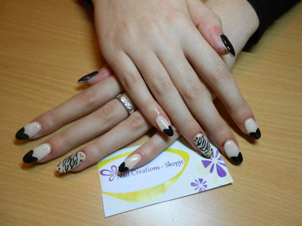 3. Elegant Pink and Black Nail Design with Geometric Lines - wide 7