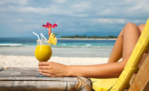 woman-having-cocktail-beach