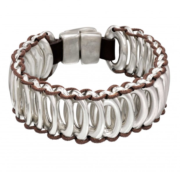 Unique bracelet with silver-plated oval beads joined together by leather strips and a silver-plated clasp. Hand-crafted in Spain.