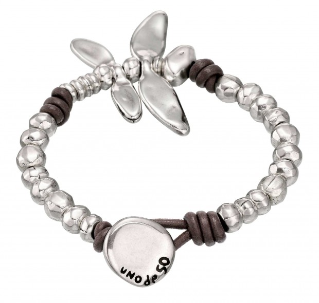 Unique bracelet with rounded beads and a silver-plated dragonfly charm linked together with leather knots. Hand-crafted in Spain.