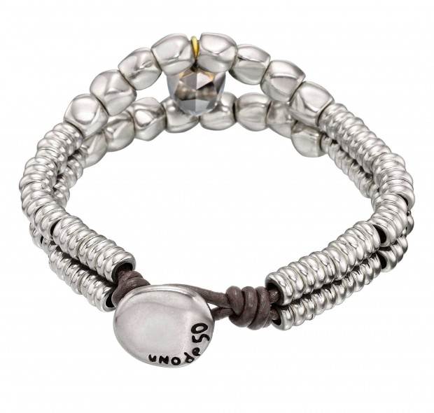 Double bracelet with round trinkets and a faceted grey toned SWAROVSKI® crystal skull. Hand-crafted in Spain.