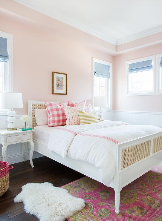 harbour-cane-bed-pink-buffalo-check-pillows-white-abacus-lamps