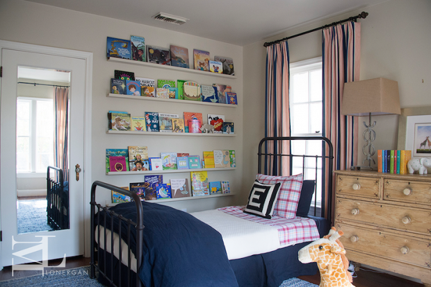 stripe-curtains-behind-kids-bed-stacked-book-ledges-navy-inen-duvet-bedskirt