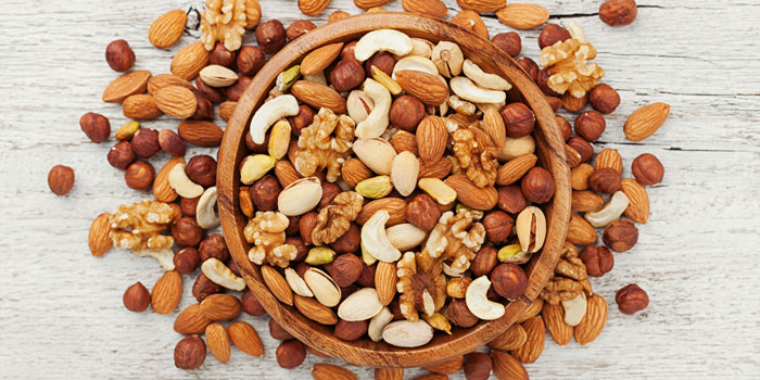 8 Healthy Fats You Should Be Eating - whole nuts, salmon, olives, olive oil, nuts, healthy fats, ground flaxseed, dark chocolate, Avocado