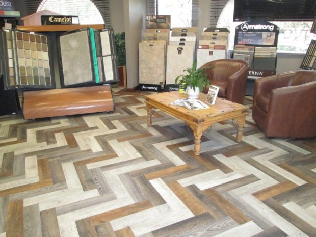 Luxury vinyl cut into strips and laid in a herringbone pattern